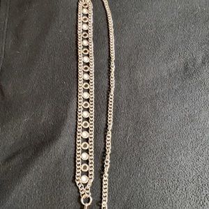 Silver chain belt with black and opal details and a pearl drop.